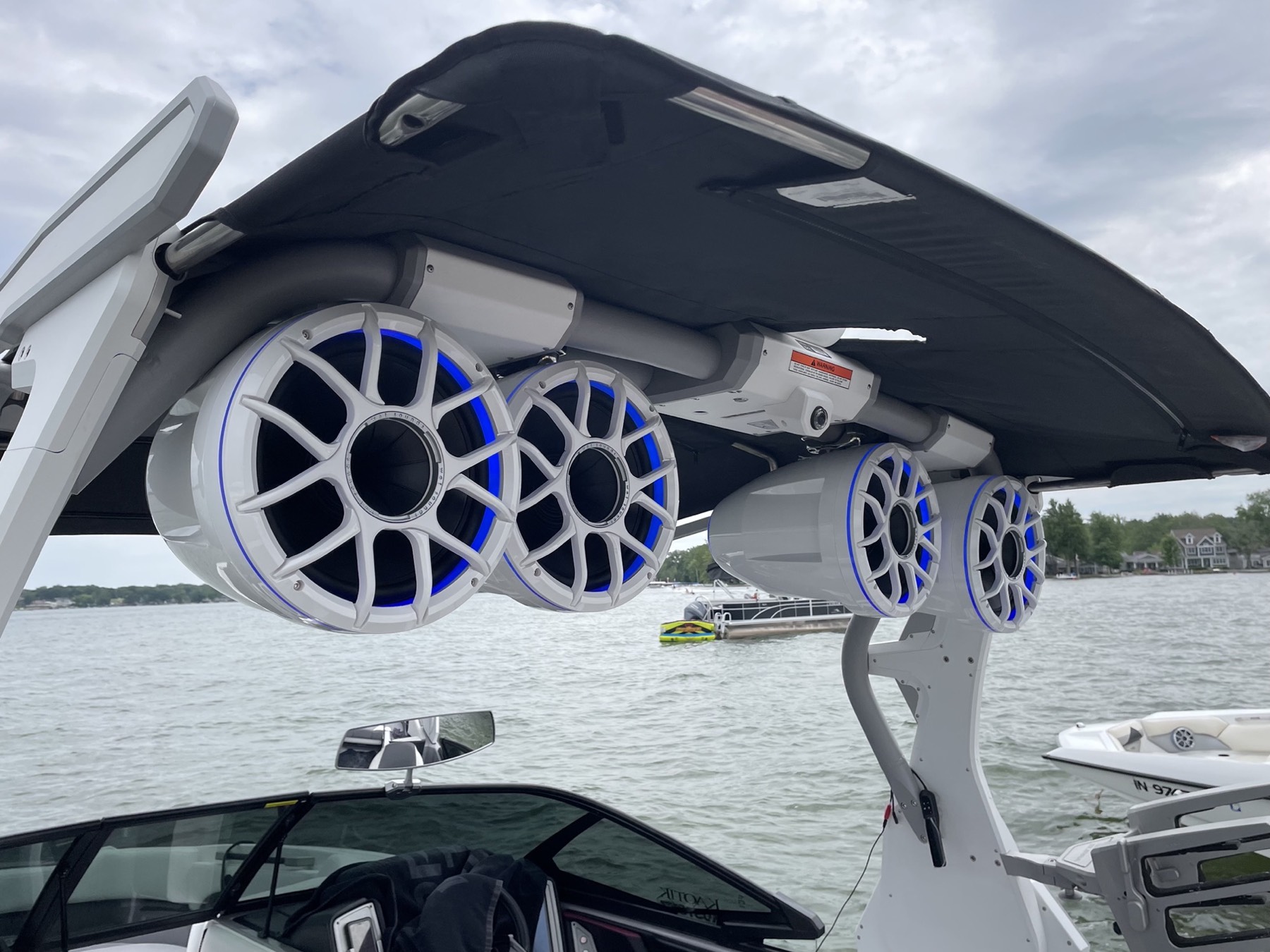 Wet Sounds tower speakers with blue LED rings on a wake boat on Lake Wawasee