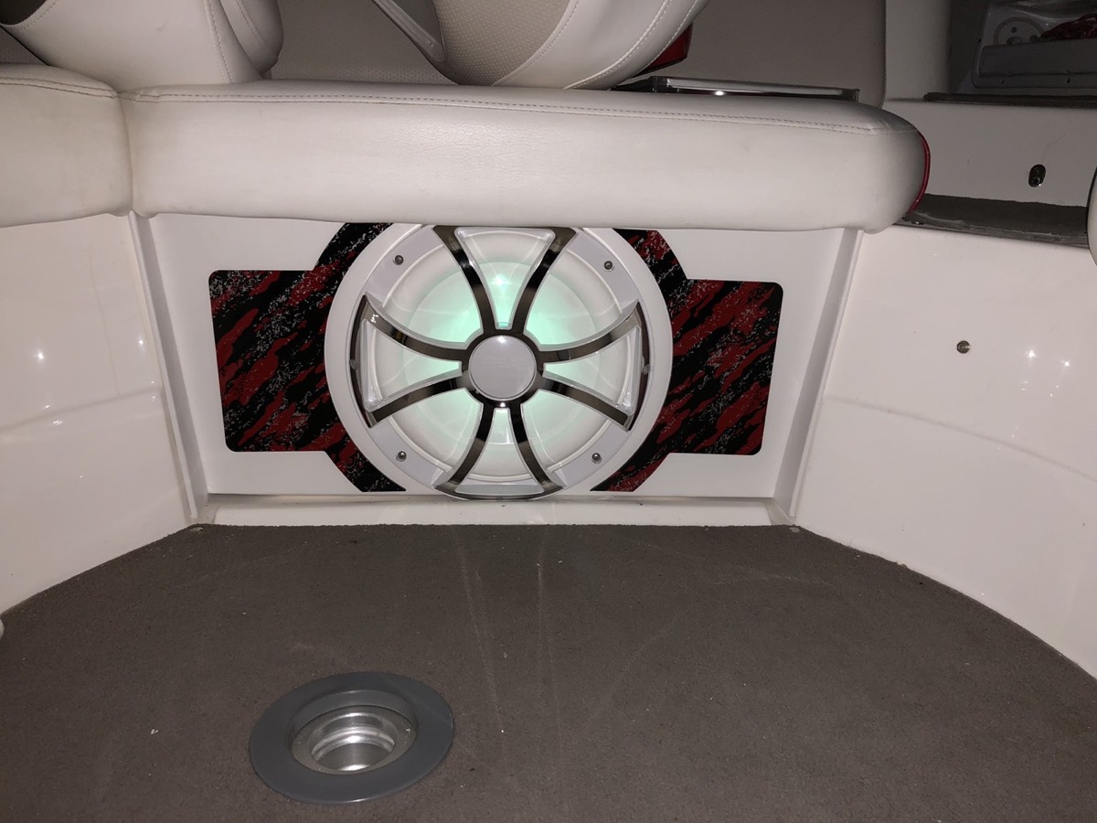 Custom red graphic subwoofer panel in a boat