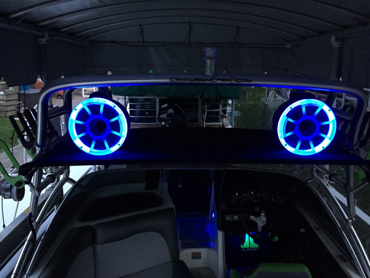 Wet Sounds speakers glowing blue at night